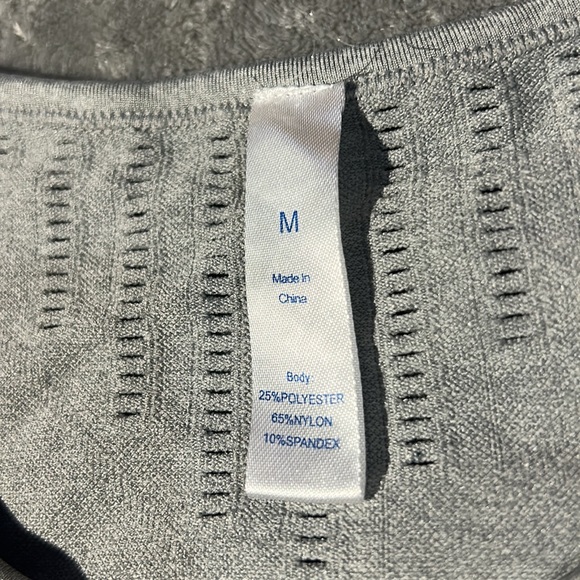 This is a workout shirt, size medium color is grey and black. - Picture 3 of 4